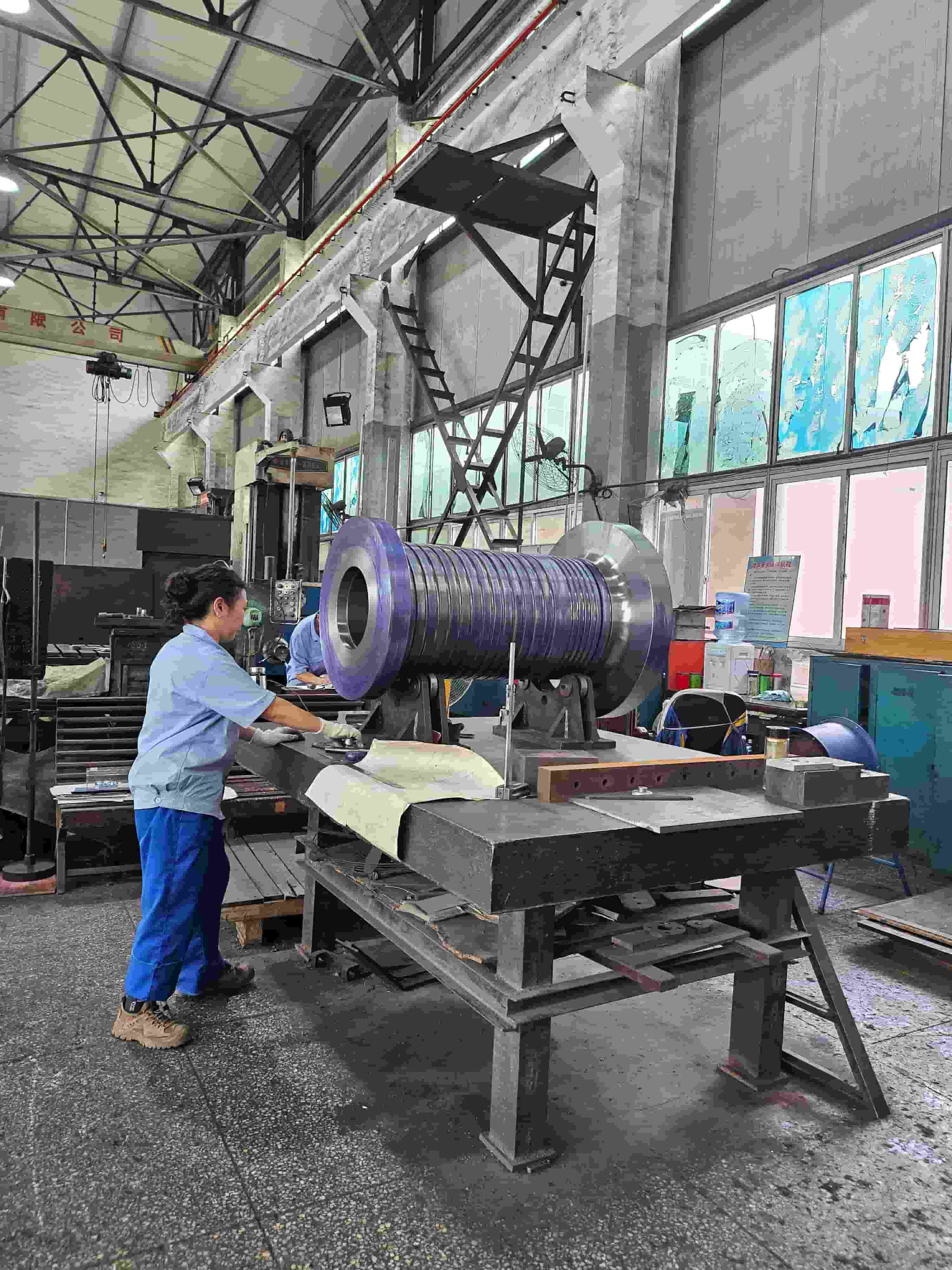 The extruding barrel is being carefully marked out before processing.